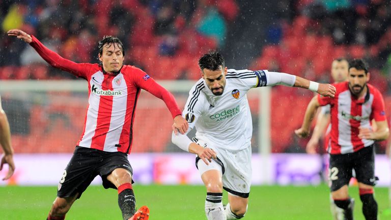 Athletic Bilbao's midfielder Ander Iturraspe (L) vies with Valencia's forward Alvaro Negredo  during the Europa League Round of 16 first leg.