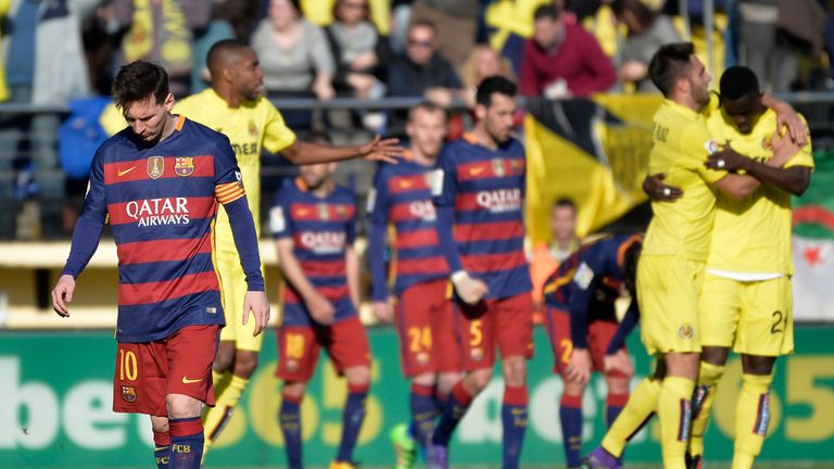 Villarreal players celebrate as Lionel Messi looks dejected