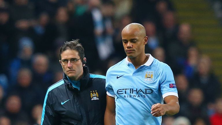 An injured Vincent Kompany leaves the pitch
