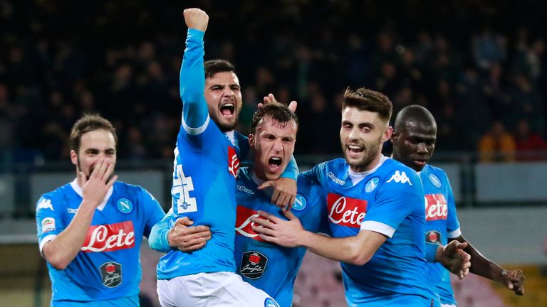 Napoli defender Vlad Chiriches celebrates with teammates after scoring a goal during the Italian Serie A football match between Napoli and Chievo 