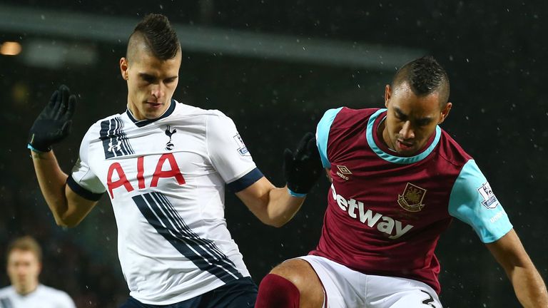 LONDON, ENGLAND - MARCH 02:  Dimitri Payet of West Ham United and Erik Lamela of Tottenham Hotspur battle for the ball during the Barclays Premier League m