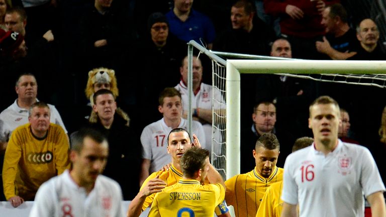 Sweden's striker and team captain Zlatan Ibrahimovic celebrates with his teammates after scoring his 2nd goal during the FIFA World Cup 2014 friendly match