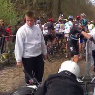 A screen grab from amateur footage of Elia Viviani after he was hit by a race motorbike at Paris-Roubaix (Picture: Twitter)