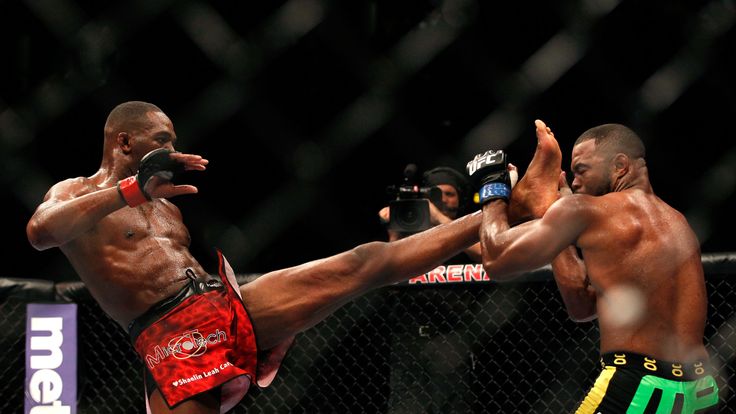 Jon Jones (L) kicks Rashad Evans during their light heavyweight title bout for UFC 145 at Philips Arena on April 21, 2012 in Atlan