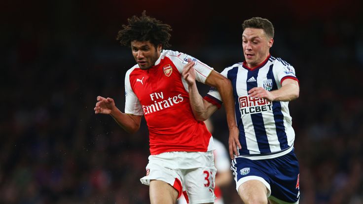 LONDON, ENGLAND - APRIL 21:  Mohamed Elneny of Arsenal holds off James Chester of West Bromwich Albion during the Barclays Premier League match between Ars