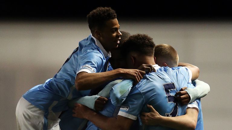 Aaron Nemane of Manchester City is congratulated by his team-mates after scoring his side's first goal during the FA Youth Cup