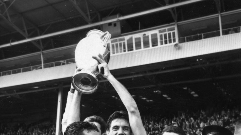 Cesare Maldini, the Milan captain holds up the European Cup