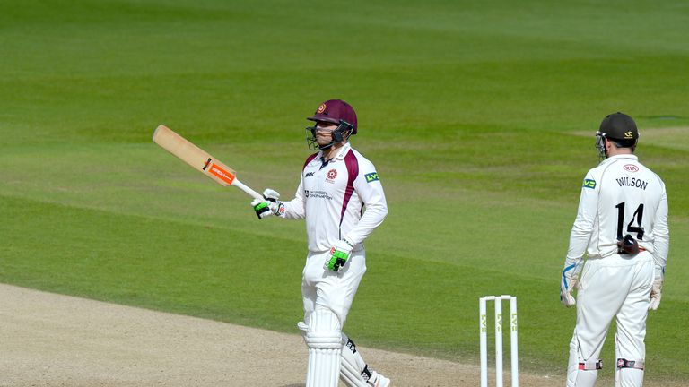 Adam Rossington of Northamptonshire celebrates reaching his 50 during the County Championship Division Two match against Surrey at The Oval