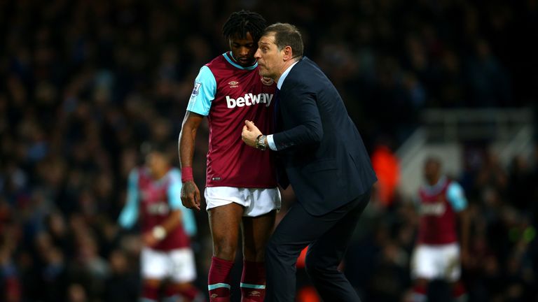 Slaven Bilic manager of West Ham United talks to Alexandre Song 