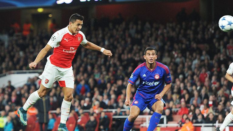 Alexis Sanchez scores against Olympiakos in the Champions League last September