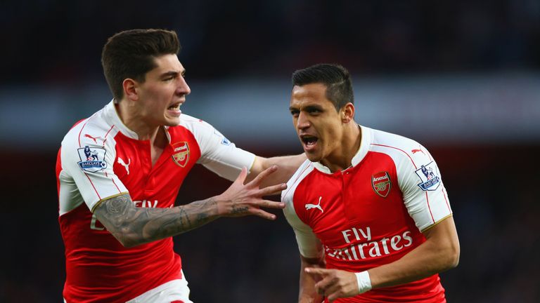 Alexis Sanchez of Arsenal (R) celebrates with Hector Bellerin as he scores their first goal during the Barclays Premier League match v West Brom
