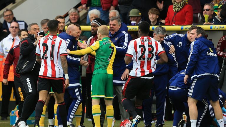 Players confront each other, with Sunderland manager Sam Allardyce in the thick of it, after a tackle from Norwich City's Robbie Brady