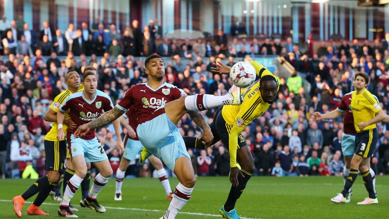 Andre Gray and Albert Adomah try to make contact with the ball