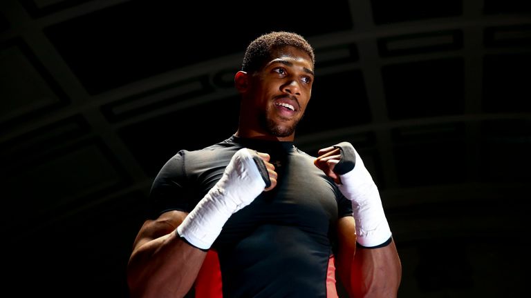 Anthony Joshua performs a public workout