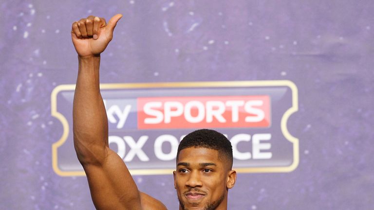 Anthony Joshua salutes the crowd after weighing in