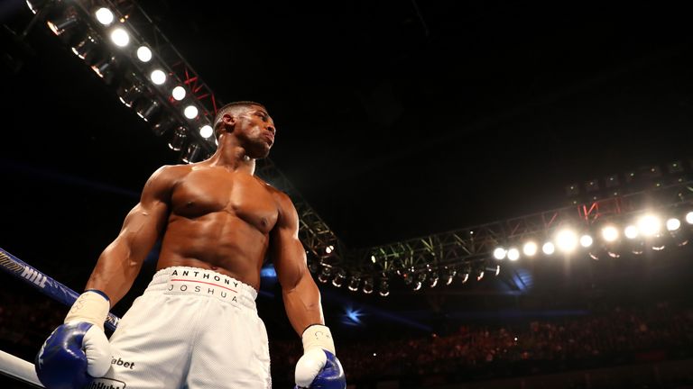 Anthony Joshua reacts after beating Charles Martin