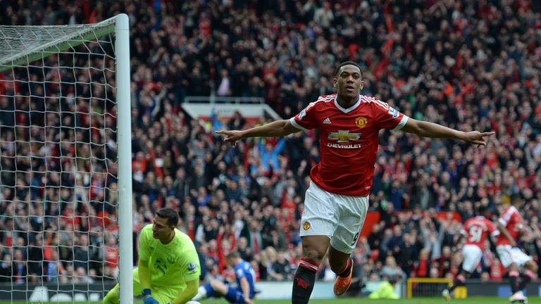 Manchester United's French striker Anthony Martial turns to celebrate after scoring the opening goal