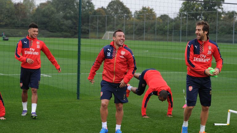 Alex Oxlade-Chamberlain (left) and Santi Cazorla during an Arsenal training session 