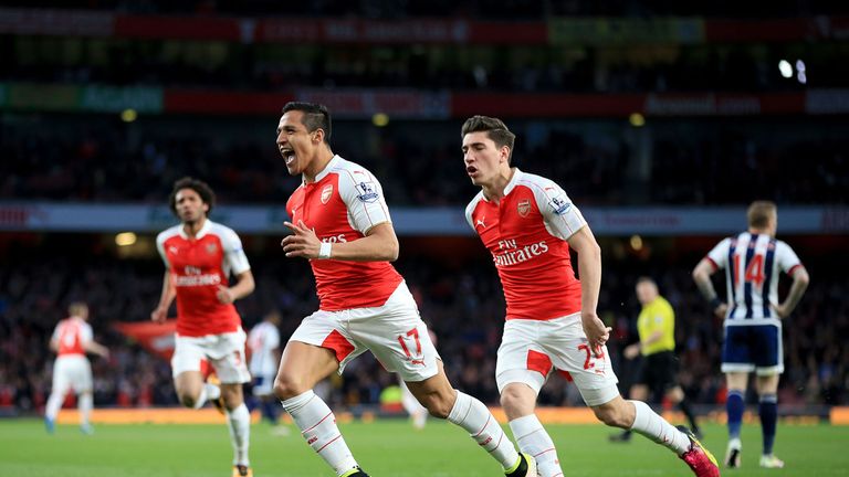 Arsenal's Alexis Sanchez (centre left) celebrates scoring their first goal of the game the Barclays Premier League match at the Emirates Stadium, London. P