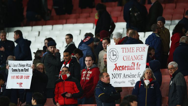 LONDON, ENGLAND - APRIL 21:  Arsenal fans hold banners after the Barclays Premier League match between Arsenal and West Bromwich Albion at the Emirates Sta