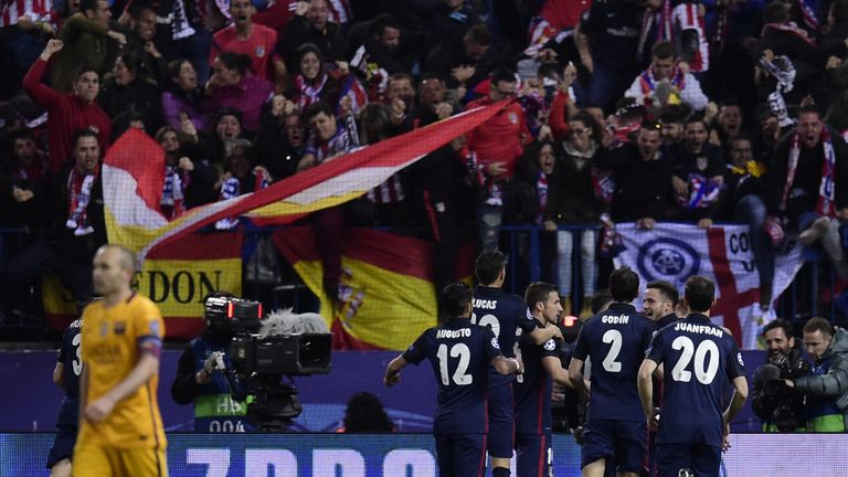 Atletico Madrid players celebrate after scoring a goal  