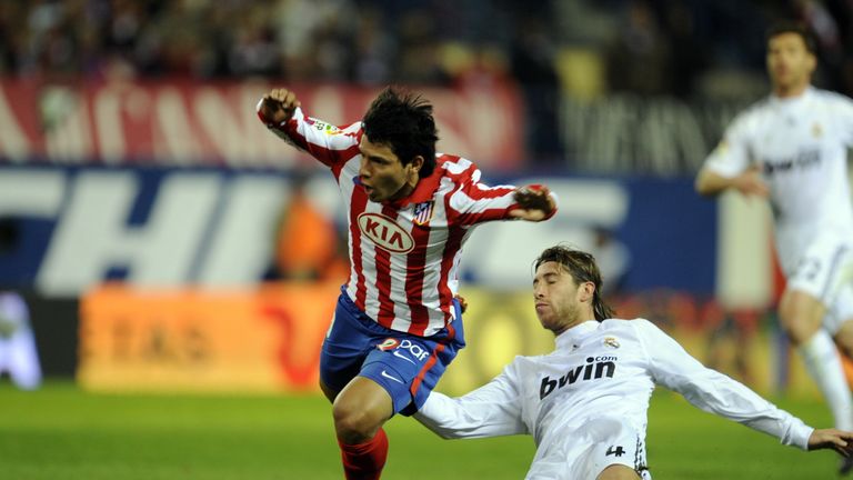 Atletico Madrid forward Sergio Aguero (L) vies with Real Madrid's defender Sergio Ramos during their Spanish League football match in November 2009