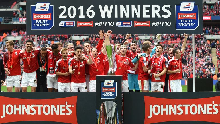 Barnsley players celebrate with the trophy