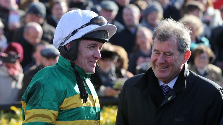 Jockey Barry Geraghty celebrates winning the Bibby Financial Services Ireland Punchestown Gold Cup with trainer of Carlingford Lough John P McManus (right)