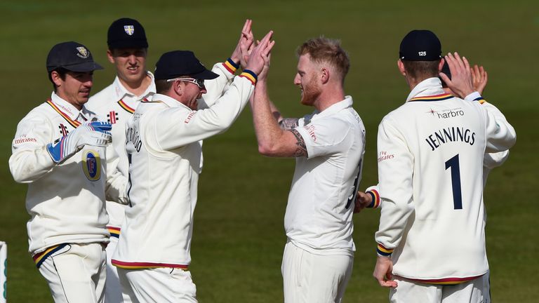 Durham bowler Ben Stokes celebrates with team mates after taking his first wicket of the day during day one of the 