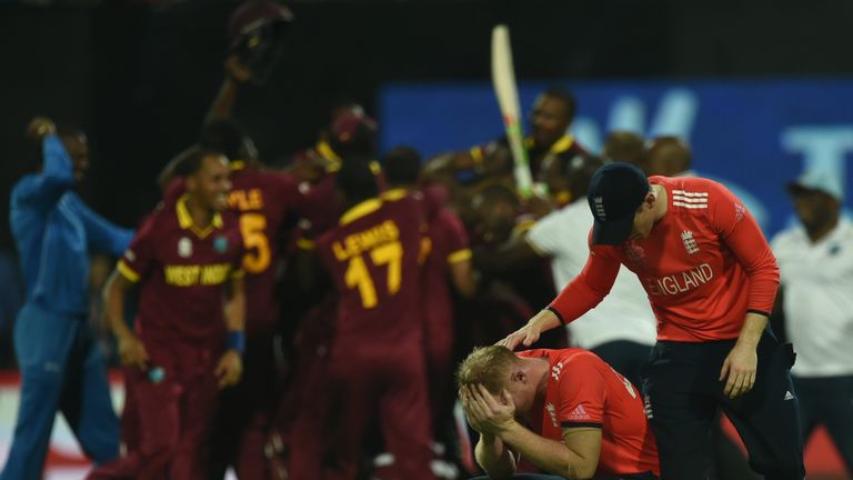 England's Ben Stokes is consoled by team captain Eoin Morgan