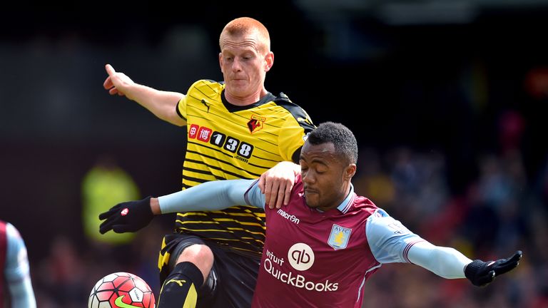 Watford's Ben Watson (left) and Aston Villa's Jordan Ayew battle for the ball 
