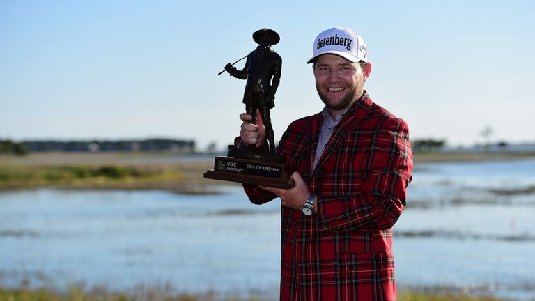HILTON HEAD ISLAND, SC - APRIL 17:  Branden Grace of South Africa poses with the trophy after winning the 2016 RBC Heritage at Harbour Town Golf Links on A