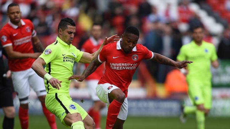 Charlton Athletic's Callum Harriott (right) and Brighton and Hove Albion's Beram Kayal battle during the Sky Bet Championship match at The Valley, Charlton