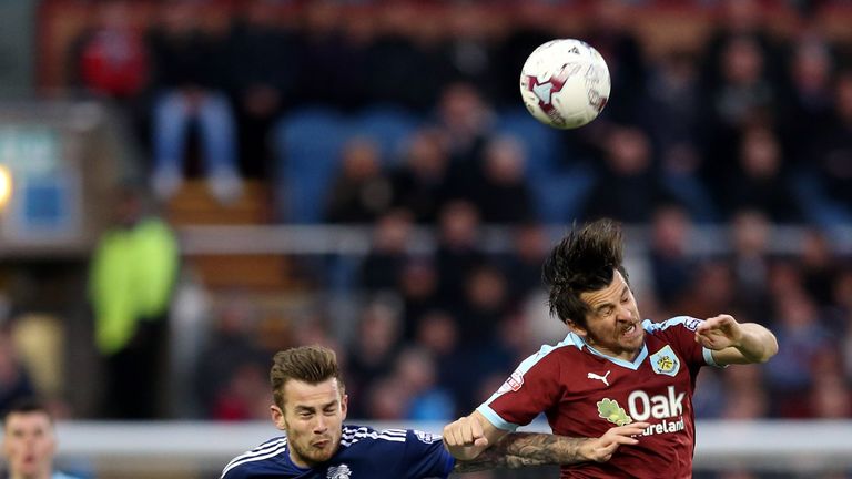 Burnley's Joey Barton battles for the ball with Joe Ralls of Cardiff