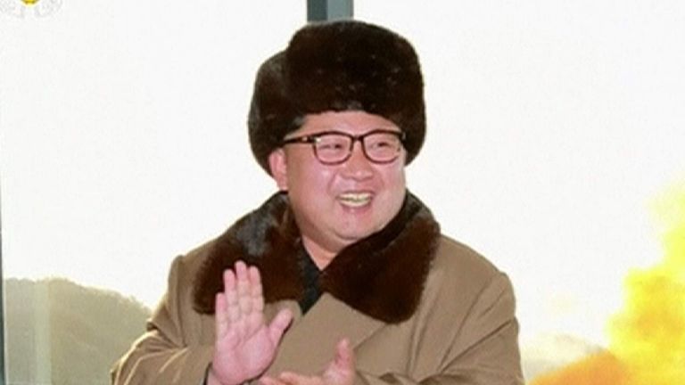North Korea's state media releases still photographs of its leader Kim Jong-Un observing what they say was a successful test of a new engine for an intercontinental ballistic missile (ICBM).