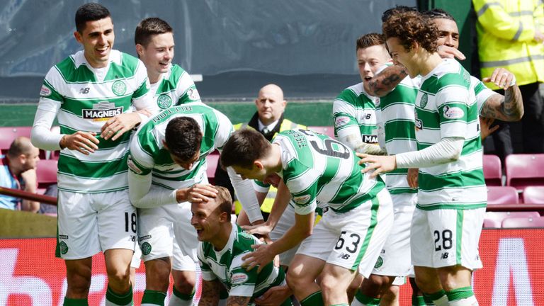 Celtic players celebrate following the third goal by Leigh Griffiths