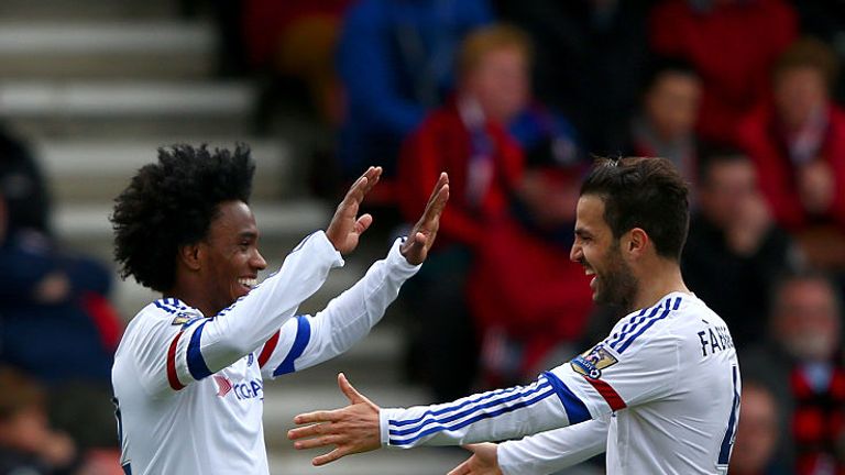 Willian of Chelsea celebrates with Cesc Fabregas of Chelsea after scoring his sides third goal