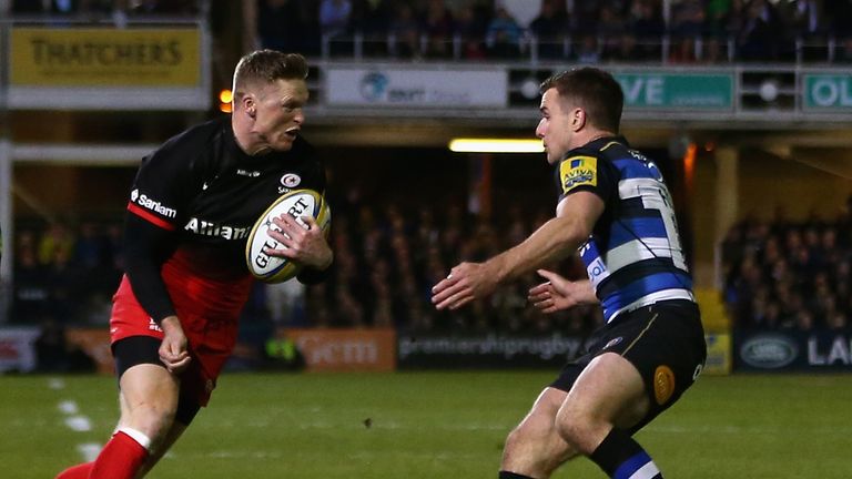 Chris Ashton (left) of Saracens takes on George Ford of Bath 