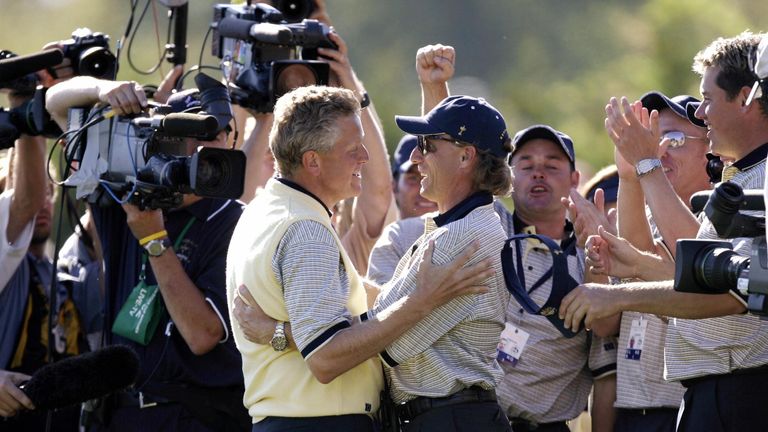 BLOOMFIELD TOWNSHIP, UNITED STATES:  European Ryder Cup golfer Colin Montgomerie (L) of Scotland embraces captain Bernhard Langer (R) of Germany after Mont