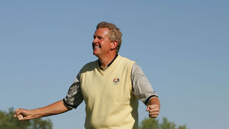 European team player Colin Montgomerie of Scotland celebrates on the 18th green after a 1up victory over USA team player David Toms  