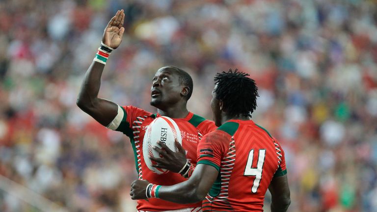 Collins Injera (L) celebrates with Augustine Lugonzo after scoring a try during Kenya's Singapore Sevens final win over Fiji