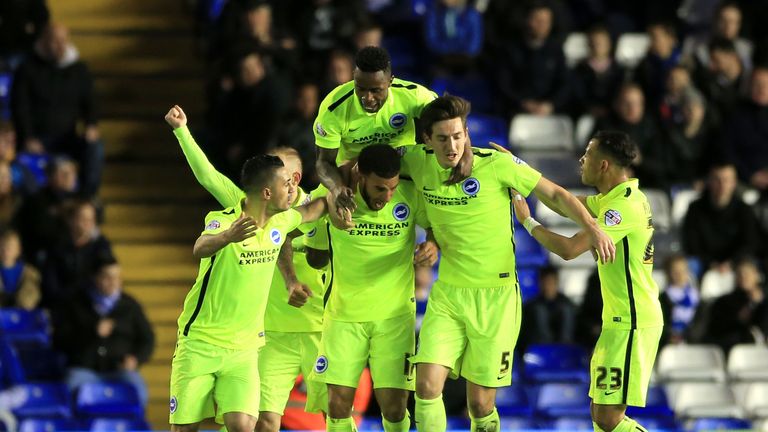 Brighton's Connor Goldson (centre) celebrates after scoring
