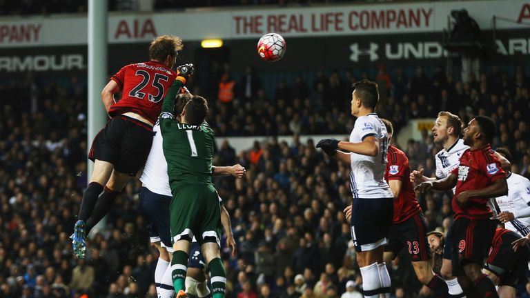 LONDON, ENGLAND - APRIL 25:  Craig Dawson of West Bromwich Albion (25) outjumps goalkeeper Hugo Lloris of Tottenham Hotspur to score their first and equali