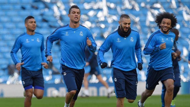 Real Madrid's Cristiano Ronaldo and Karim Benzema take part in a training session