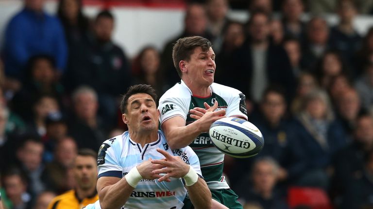 Freddie Burns of Leicester and Racing 92's Dan Carter compete for the ball