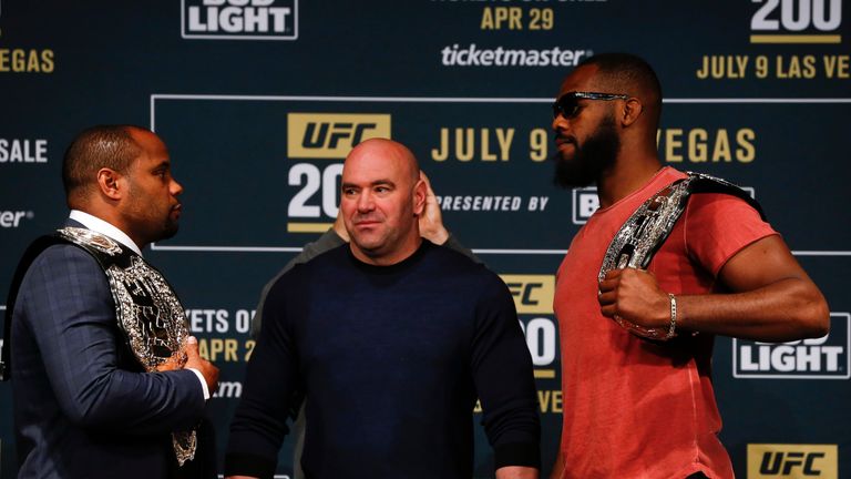 UFC president Dana White stands between Daniel Cormier (L) and Jon Jones as they square off during media availability for UFC 200