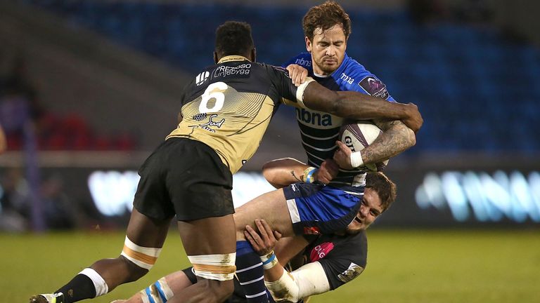 Danny Cipriani is tackled by Montpellier's Fulgence Ouedraogo