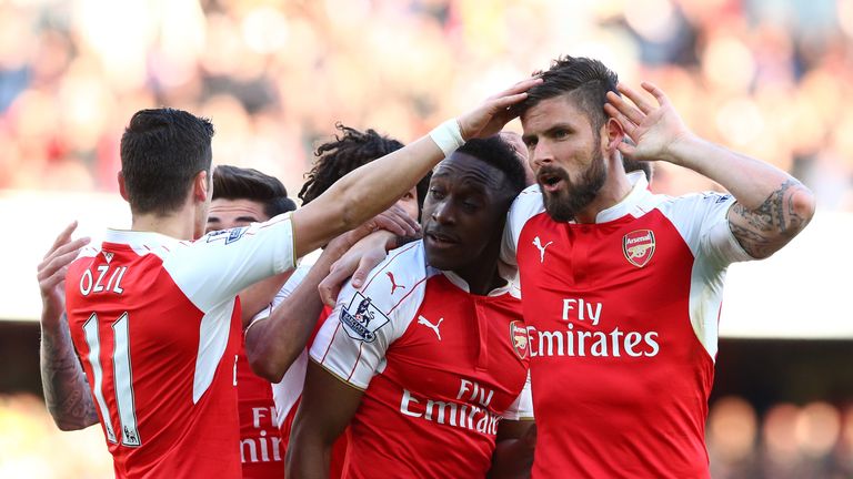 Danny Welbeck of Arsenal celebrates scoring the opening goal with Olivier Giroud (R)