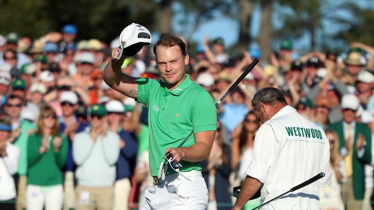 Danny Willett of England reacts after finishing on the 18th green 