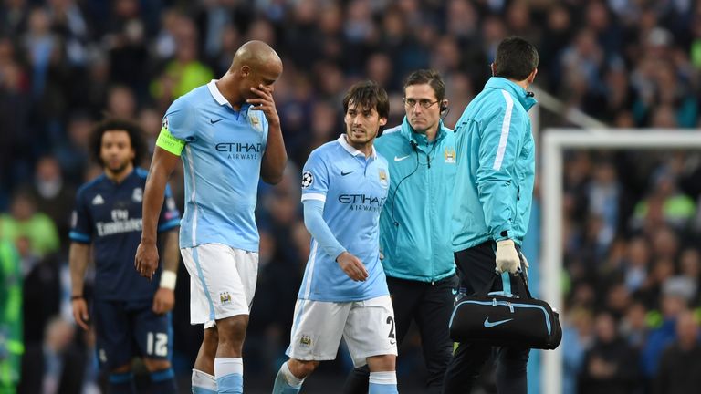 David Silva of Manchester City leaves the pitch due to injury
